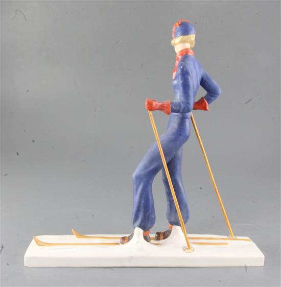 A William Goebel Art Deco pottery figure of a woman skier, height 32.5cm, ski poles re-attached
